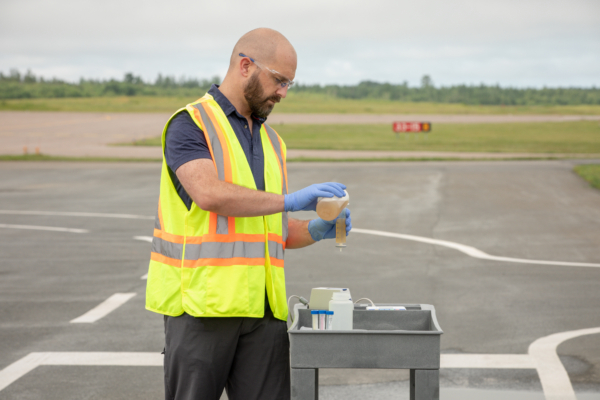 technician running bugcount fuel test on tarmac