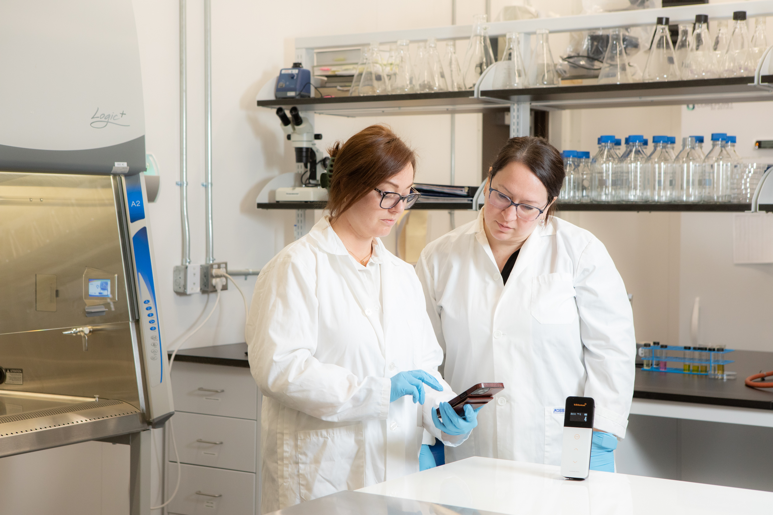 two food technicians running a test