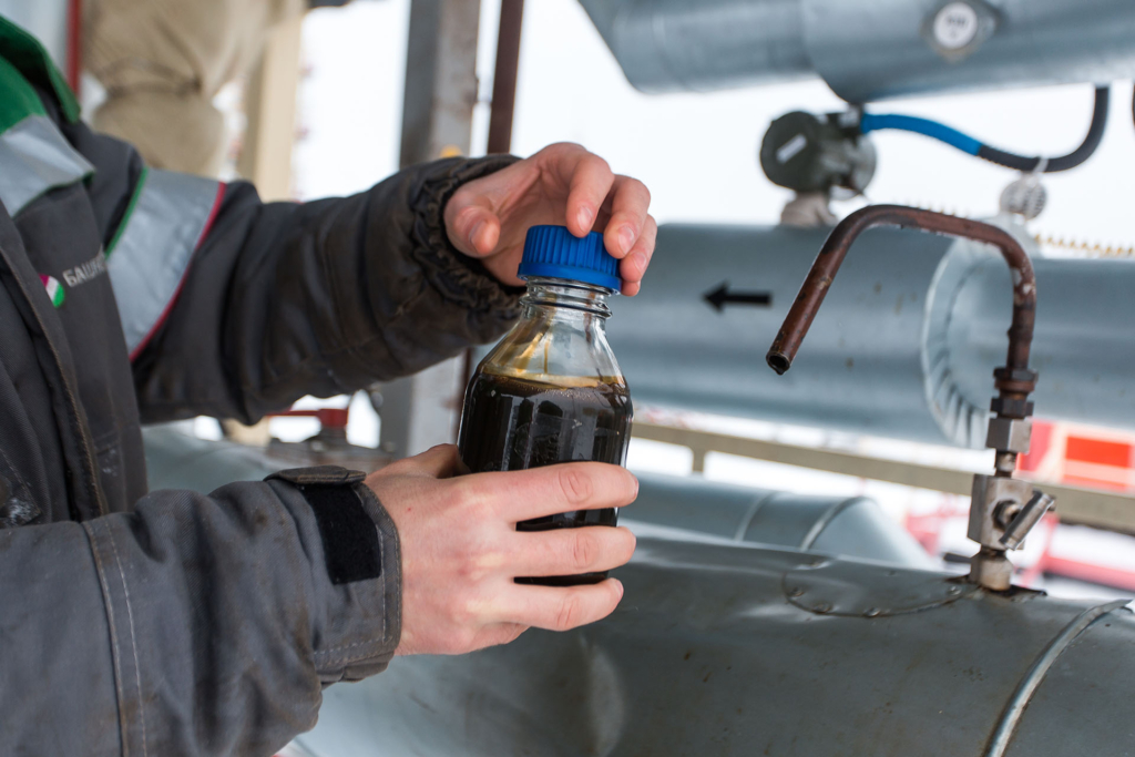 Person working with oil