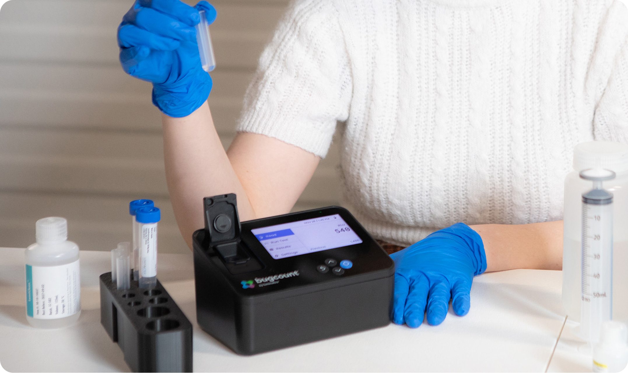 woman testing with bugcount analyzer device