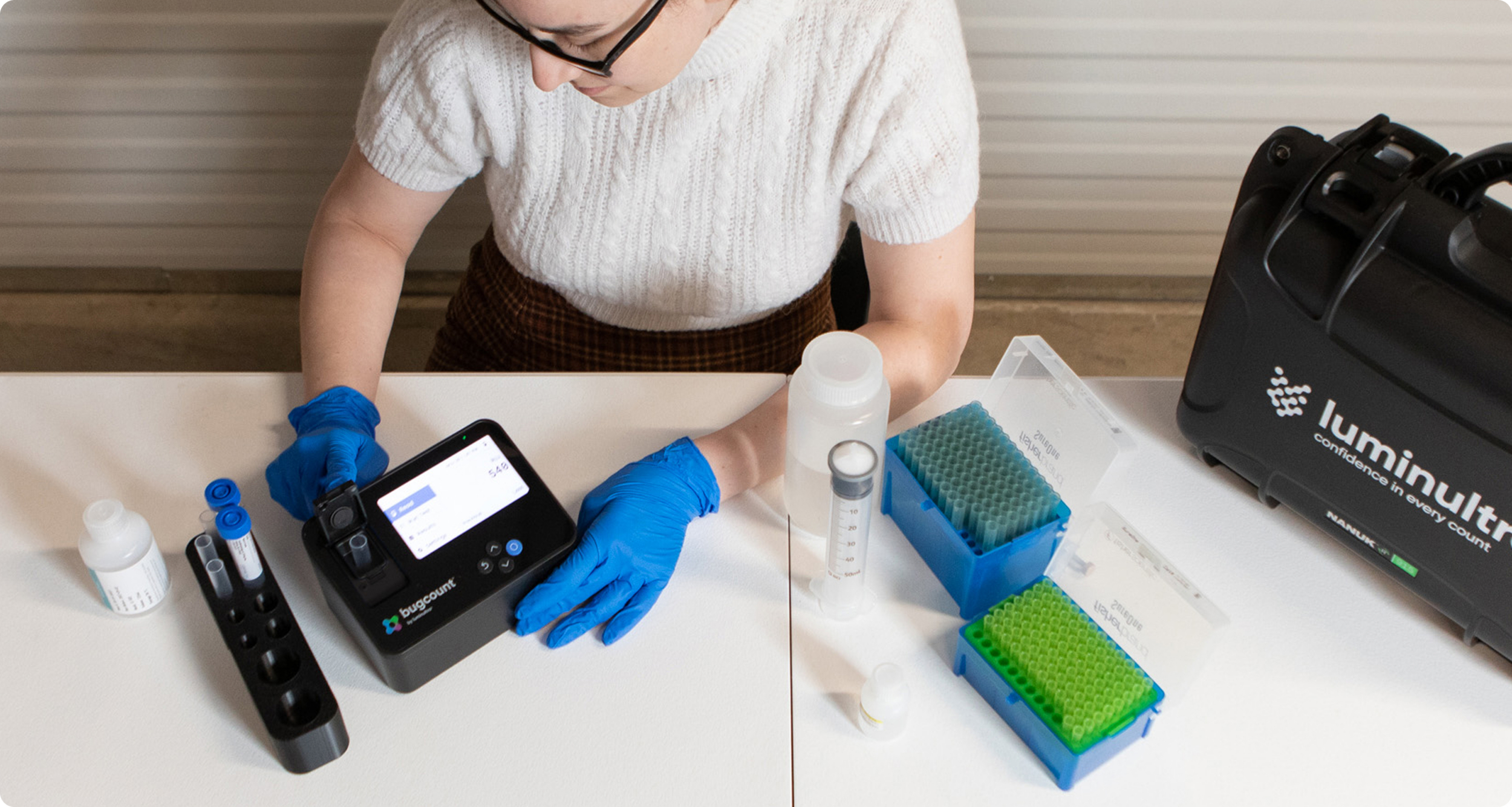 woman testing with bugcount analyzer device