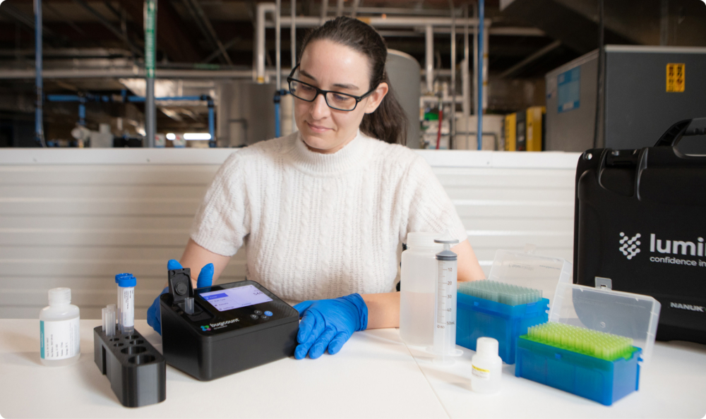 woman testing with bugcount analyzer device