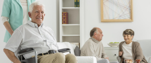 Residents sitting in a senior care facility